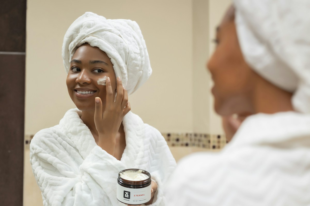 Woman caring for her skin as part of her skincare routine